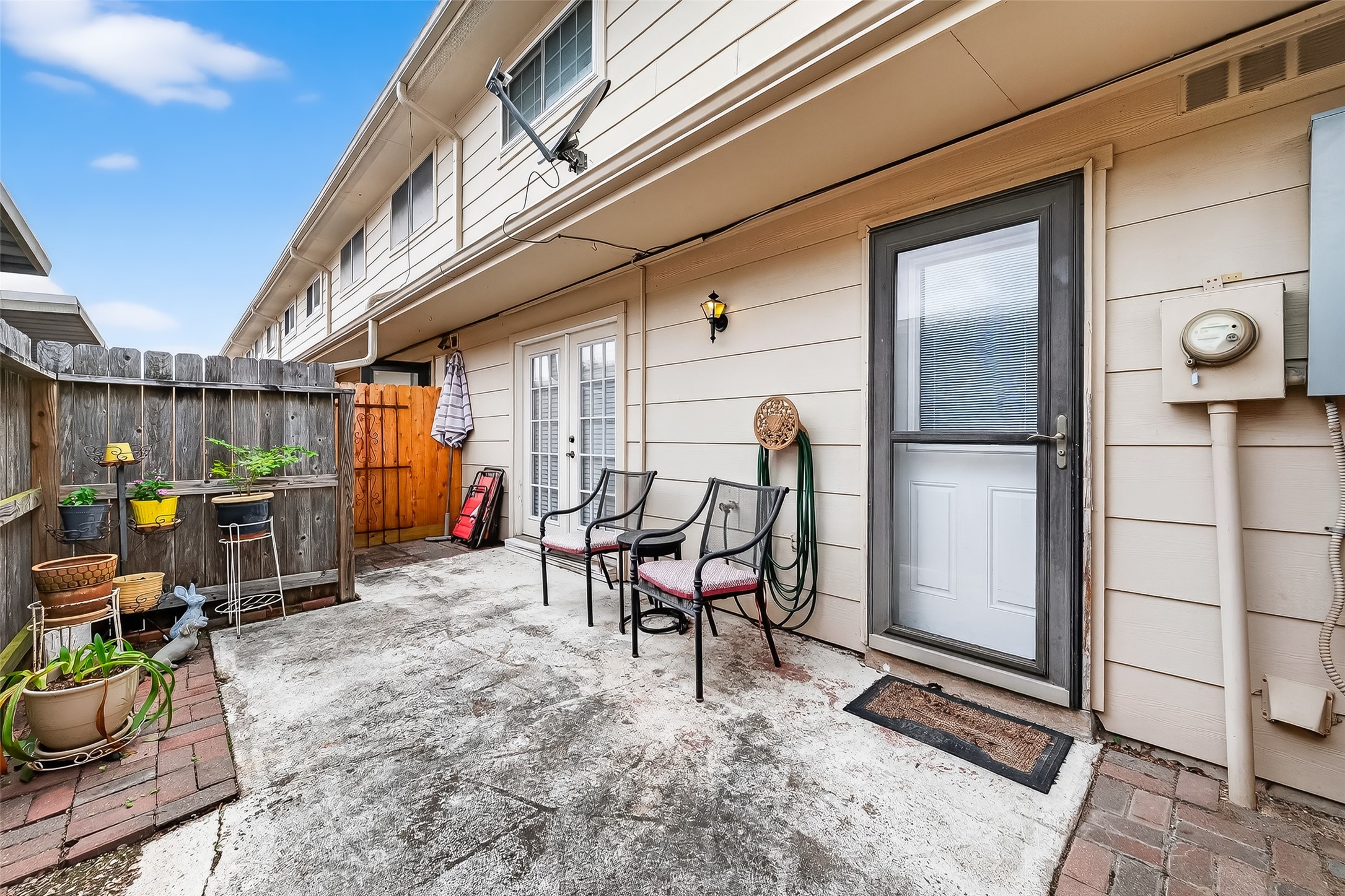 14690 Perthshire Road, Unit C Houston, TX 77079 - Photo 45 of 48 The fenced back patio offers a secluded outdoor stage for morning coffee or evening dining under the stars.