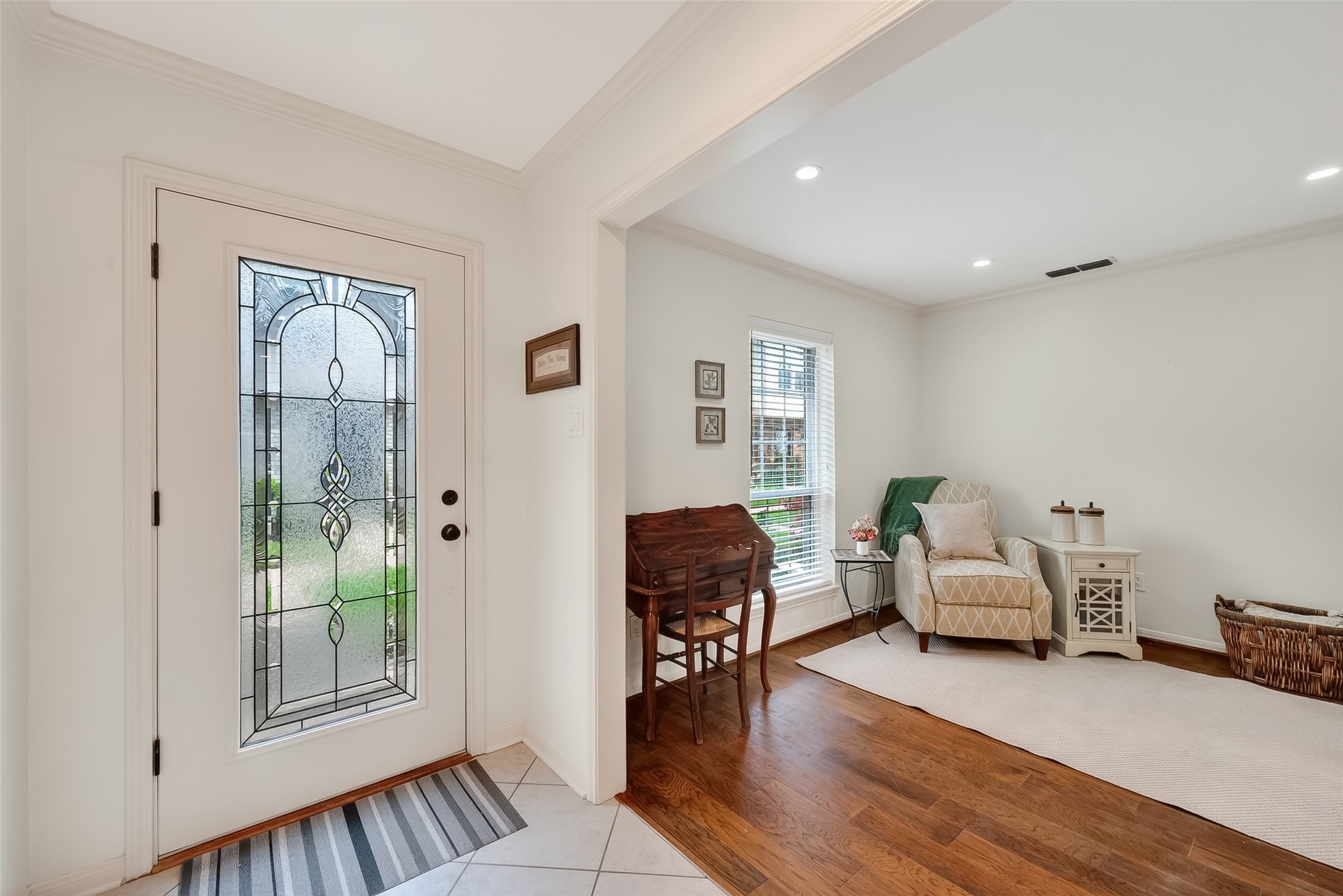 14690 Perthshire Road, Unit C Houston, TX 77079 - Photo 6 of 48 The stylish glass-paned door filters soft radiance into the foyer, offering an immediate glimpse of the refined formal space just off to the side.