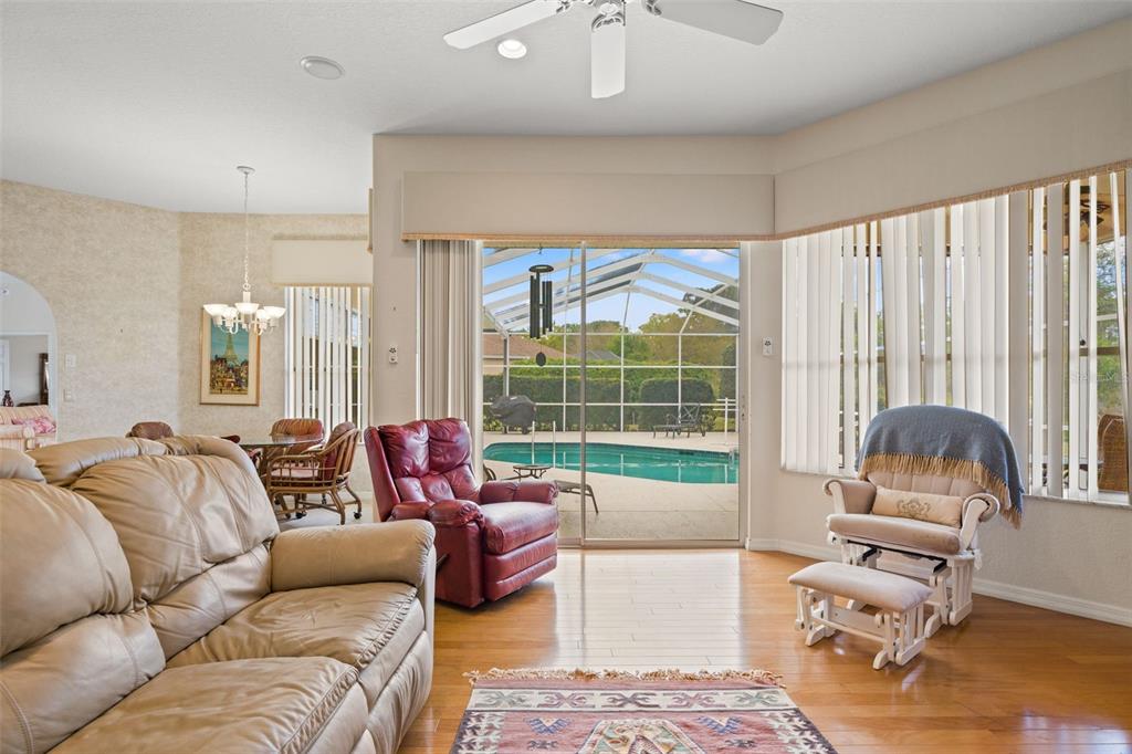 8405 Maybelle Drive Weeki Wachee, FL 34613 - Photo 16 of 61 a living room with furniture and a large window