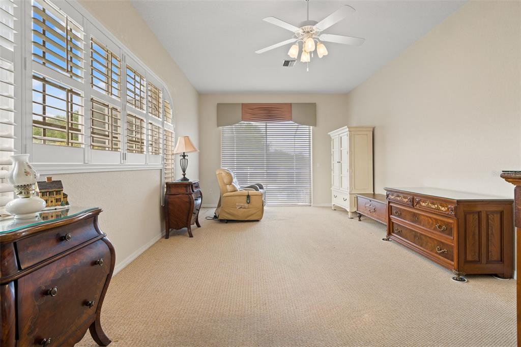 8405 Maybelle Drive Weeki Wachee, FL 34613 - Photo 26 of 61 a bedroom with furniture and a chandelier