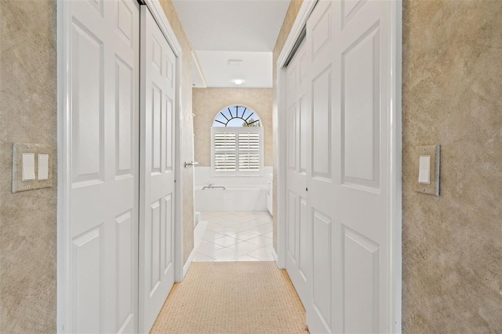 8405 Maybelle Drive Weeki Wachee, FL 34613 - Photo 27 of 61 a view of a hallway with wooden floor and windows