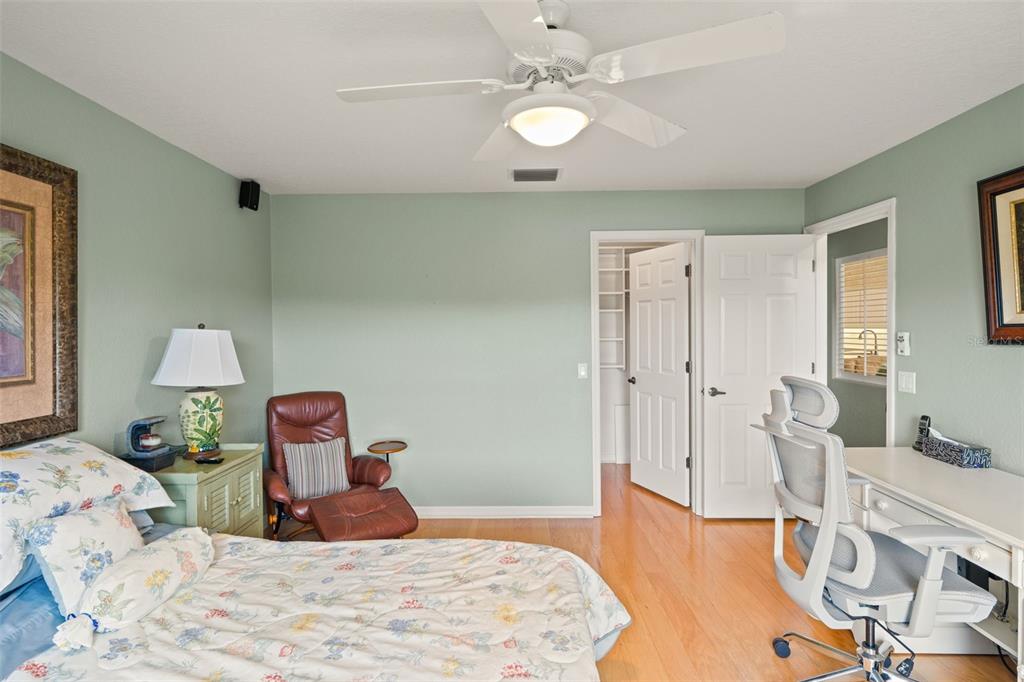 8405 Maybelle Drive Weeki Wachee, FL 34613 - Photo 29 of 61 a bedroom with a bed and a chandelier