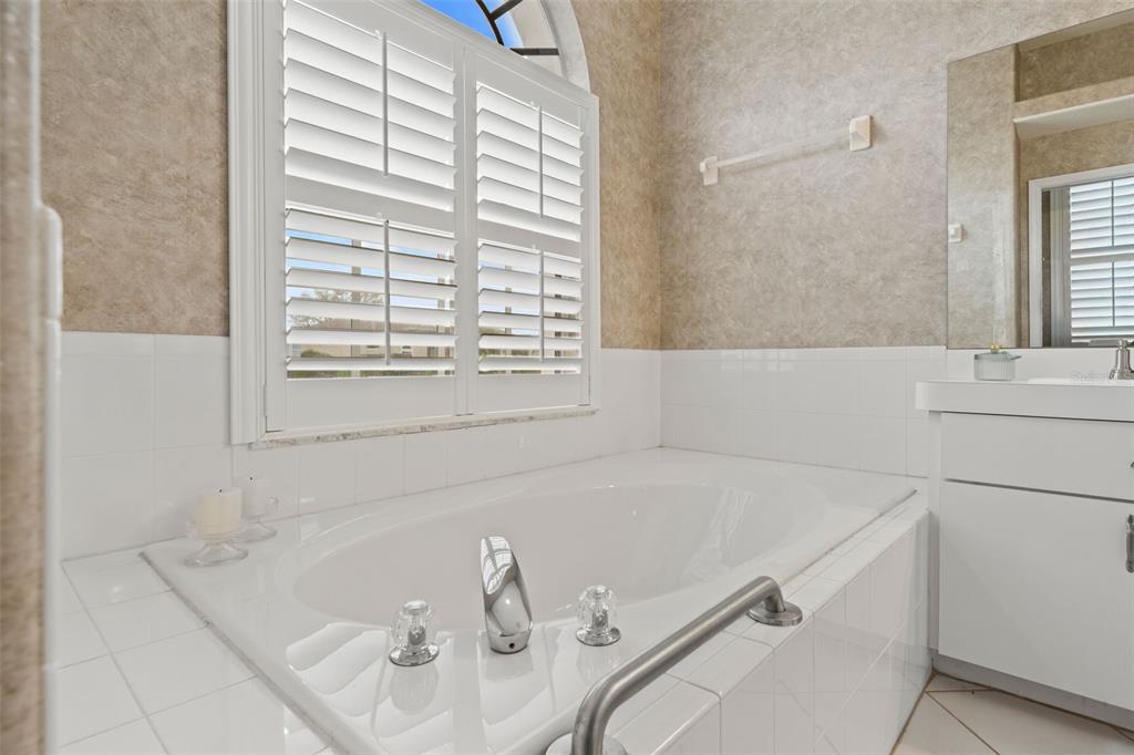 8405 Maybelle Drive Weeki Wachee, FL 34613 - Photo 32 of 61 a bathroom with a tub and a sink