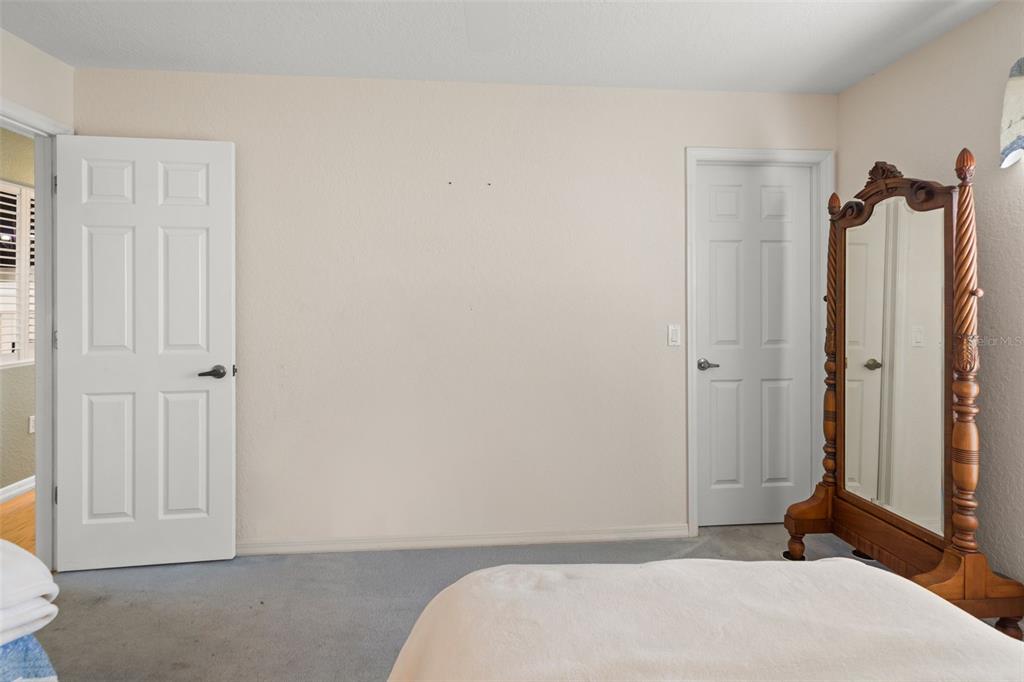 8405 Maybelle Drive Weeki Wachee, FL 34613 - Photo 35 of 61 a bedroom with a bed and a closet