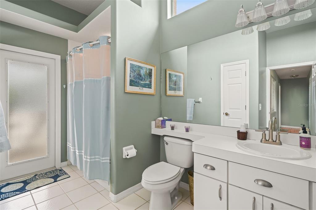 8405 Maybelle Drive Weeki Wachee, FL 34613 - Photo 36 of 61 a bathroom with a toilet sink and mirror