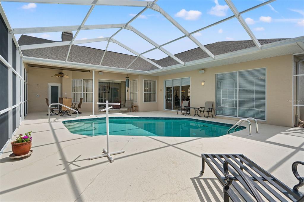 8405 Maybelle Drive Weeki Wachee, FL 34613 - Photo 39 of 61 a swimming pool with outdoor seating and yard
