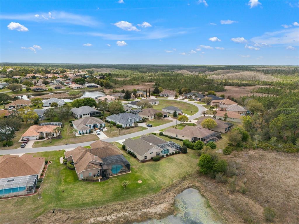 8405 Maybelle Drive Weeki Wachee, FL 34613 - Photo 47 of 61 an aerial view of residential houses with outdoor space