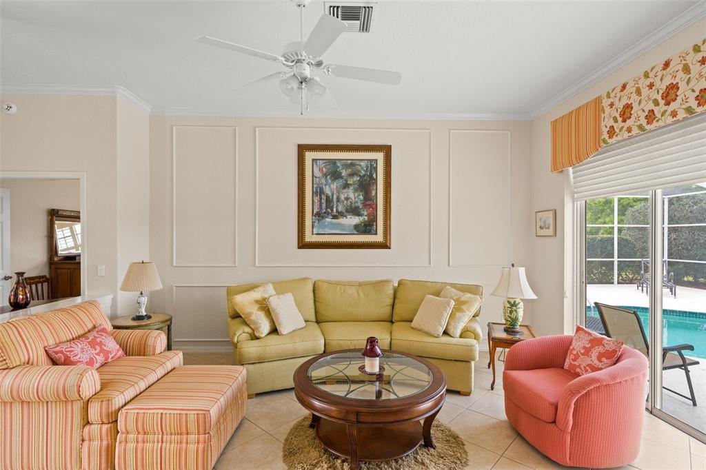 8405 Maybelle Drive Weeki Wachee, FL 34613 - Photo 6 of 61 a living room with furniture a couch and a window