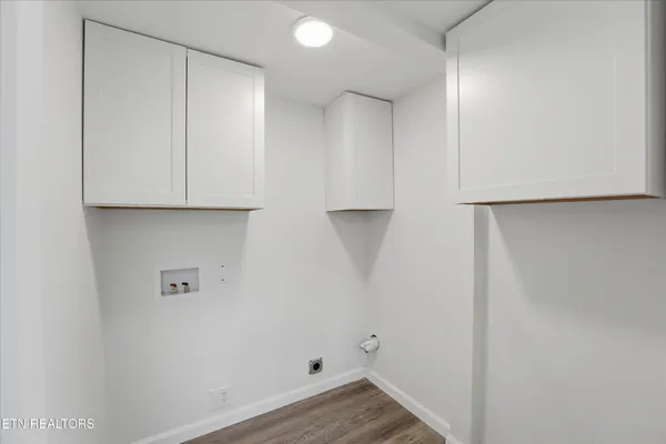 a view of cabinets and wooden floor