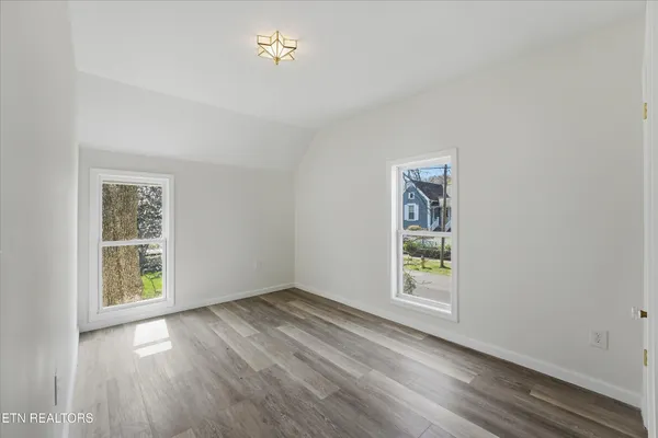 an empty room with windows