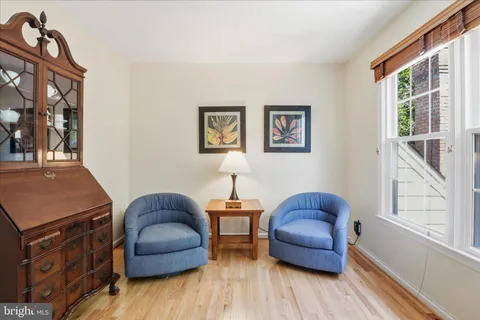 a bedroom with a bed and a night stand