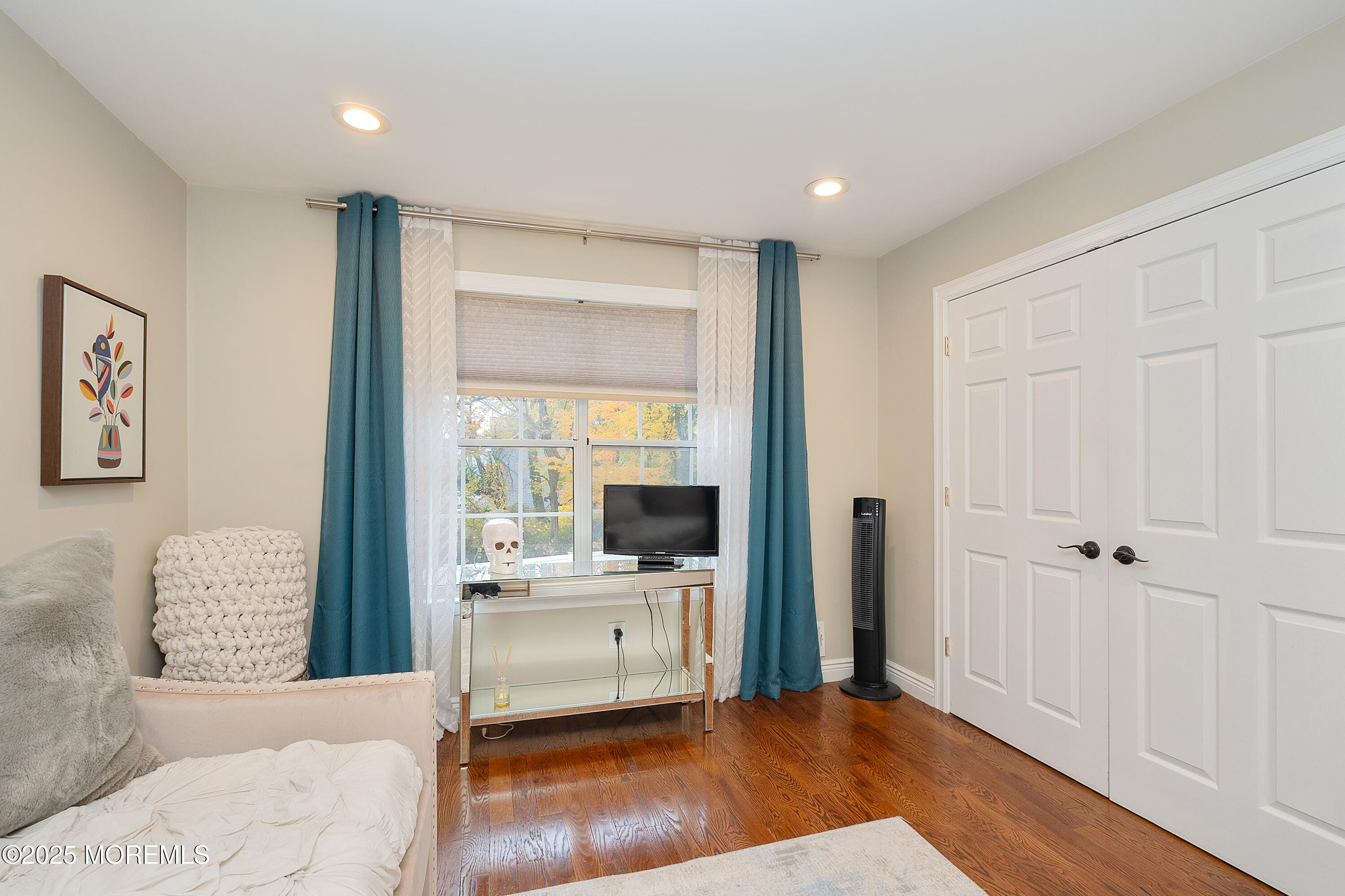 121 Milton Avenue Cliffwood, NJ 07721 - Photo 12 of 34 a living room with a large window and a wooden floor