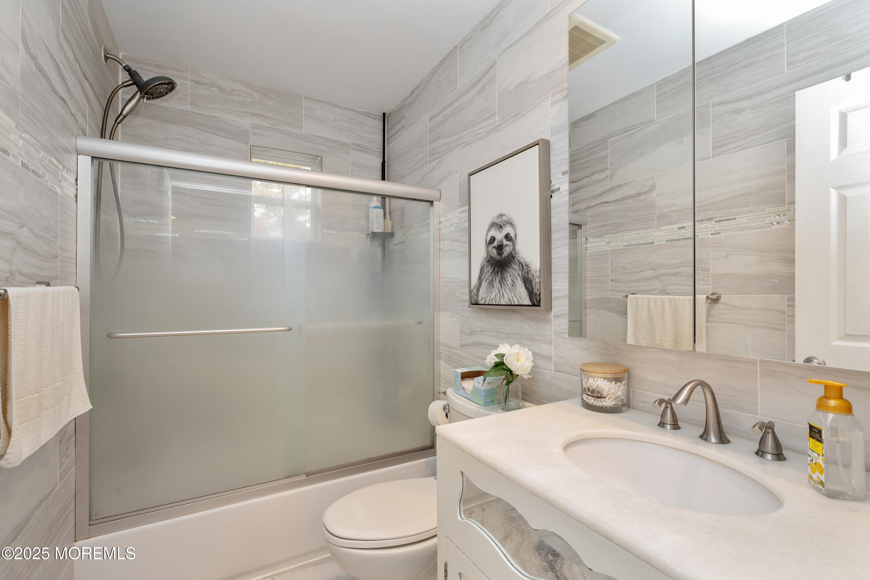 121 Milton Avenue Cliffwood, NJ 07721 - Photo 17 of 34 a bathroom with a sink toilet and shower