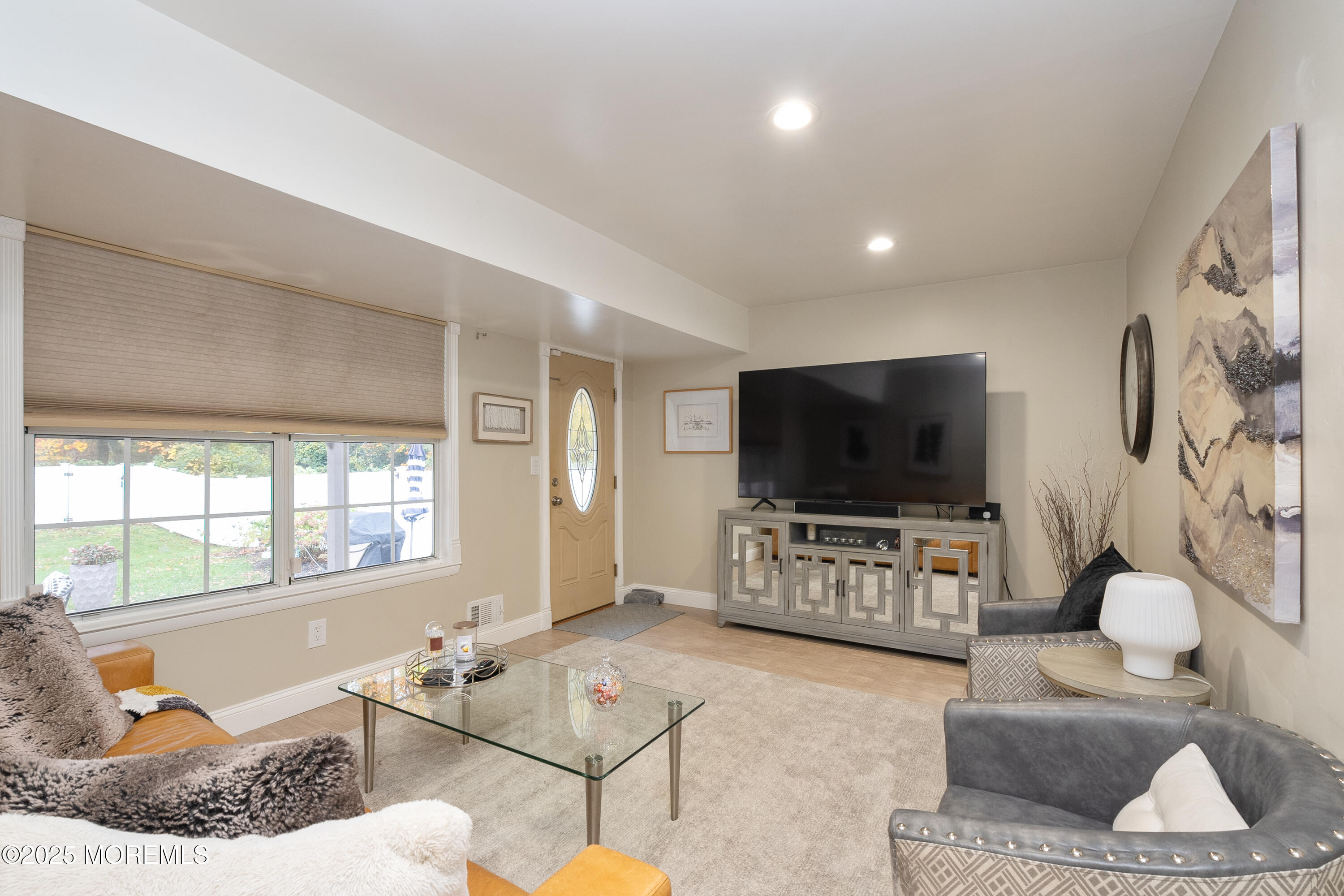 121 Milton Avenue Cliffwood, NJ 07721 - Photo 22 of 34 a living room with furniture and a flat screen tv