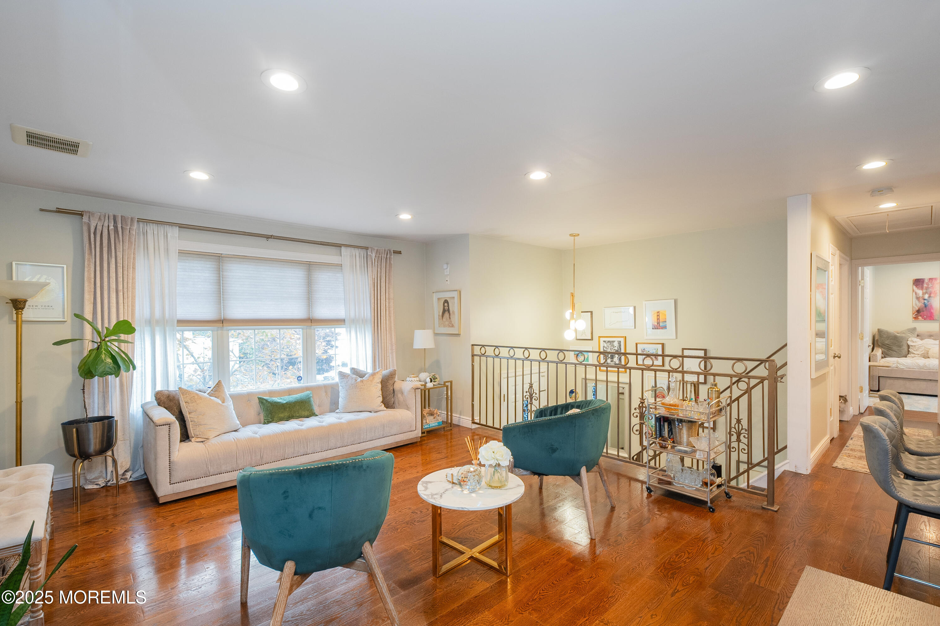 121 Milton Avenue Cliffwood, NJ 07721 - Photo 6 of 34 a living room with furniture and a table with wooden floor