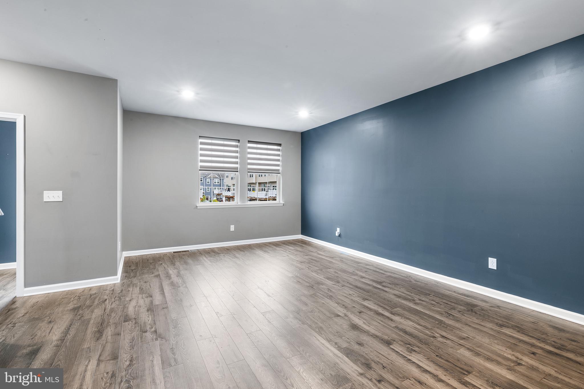 62 Rome Way Mount Laurel, NJ 08054 - Photo 14 of 31 a view of an empty room with a window and wooden floor