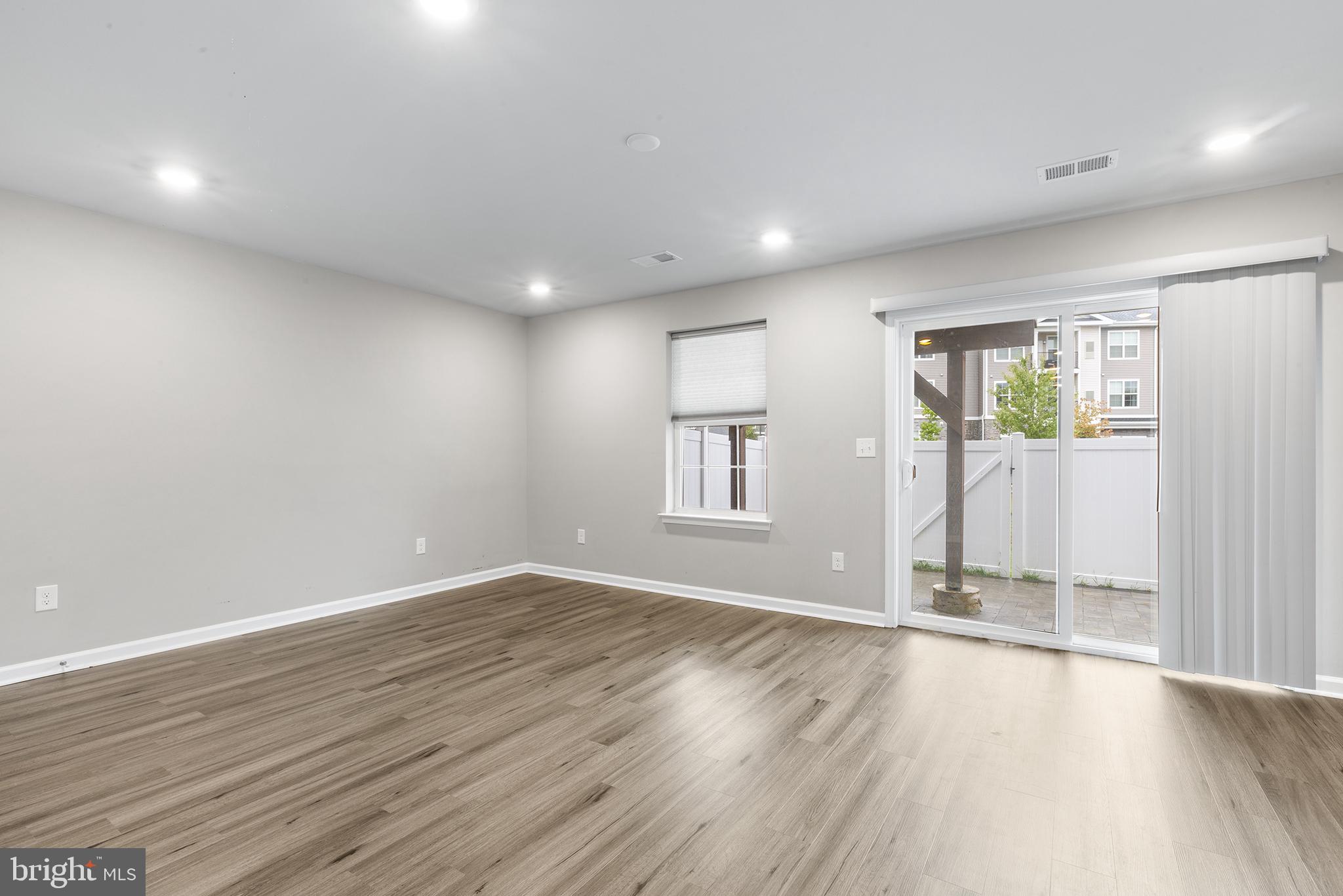62 Rome Way Mount Laurel, NJ 08054 - Photo 15 of 31 an empty room with wooden floor and windows