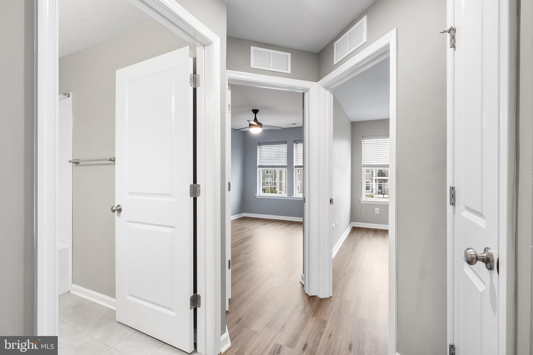 62 Rome Way Mount Laurel, NJ 08054 - Photo 19 of 31 a view of a hallway with wooden floor and closet area