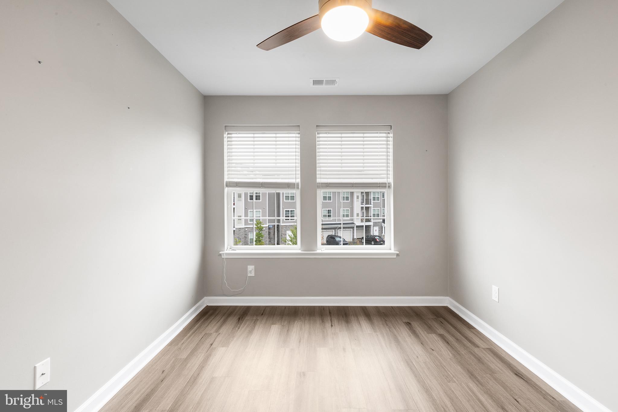 62 Rome Way Mount Laurel, NJ 08054 - Photo 20 of 31 an empty room with wooden floor and windows