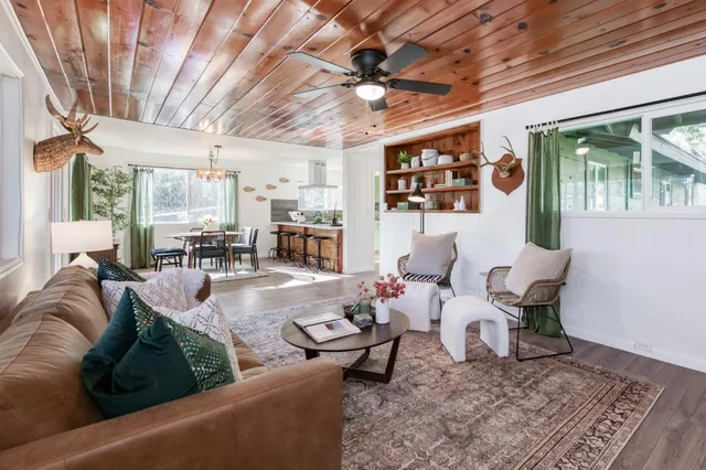 a view of a dining room with furniture window and outside view