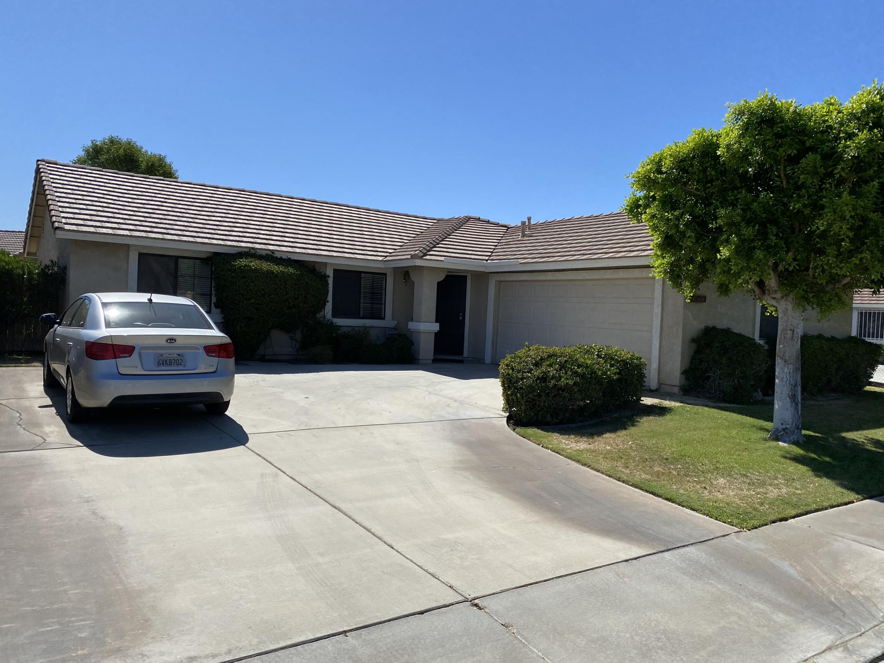 a house view with a garden space