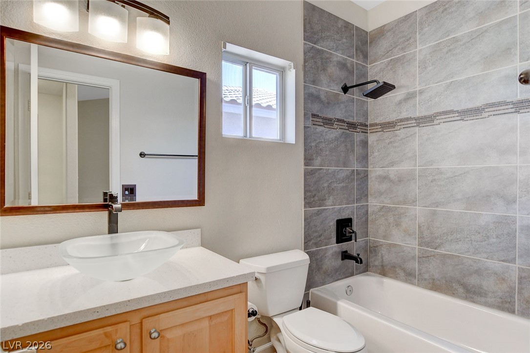191 Verde Ridge Court Henderson, NV 89012 - Photo 30 of 36 Bathroom featuring bathtub / shower combination, toilet, and vanity