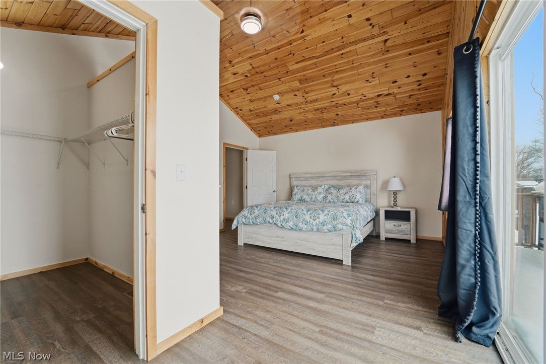 5919 Lake Road West, Unit 32 Ashtabula, OH 44004 - Photo 15 of 23 Bedroom with a vaulted wooden ceiling and wood finished floors