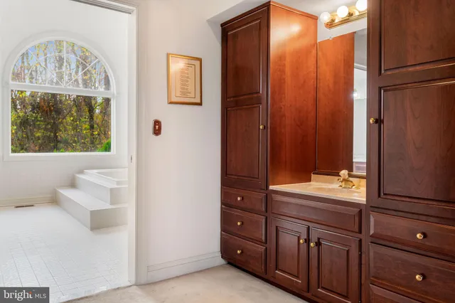 a bathroom with a bathtub and a sink
