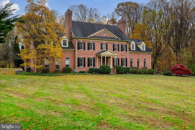 a front view of a building with a garden