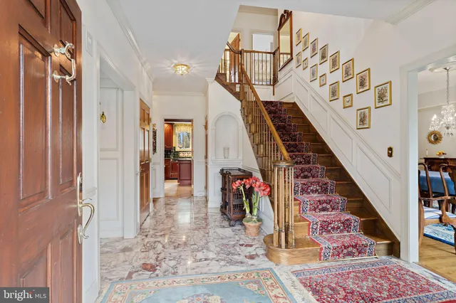 a view of an entryway with wooden floor