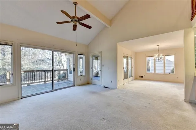 a view of a room with windows and chandelier