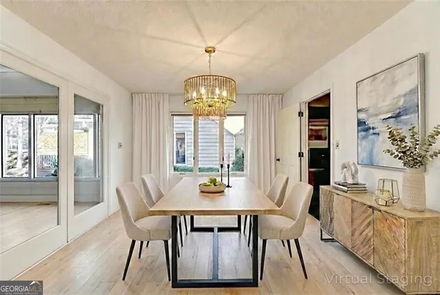 a kitchen with stainless steel appliances a sink a stove and cabinets