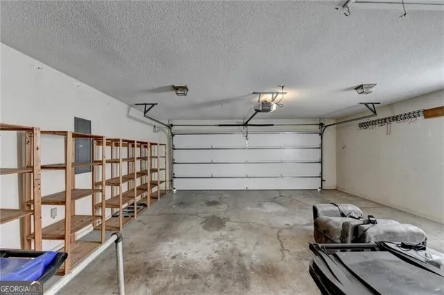 a bathroom with a granite countertop double vanity sink and a mirror