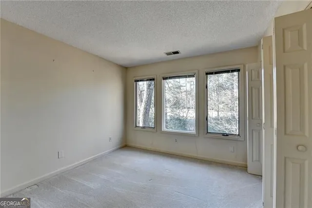 a view of a backyard of the house