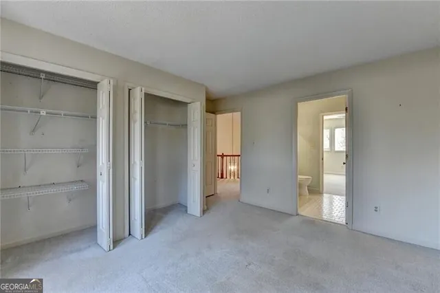 a view of road with large trees