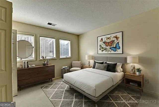 an aerial view of a house with a garden and lake view