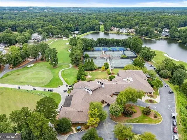 a view of a park with trees in the background