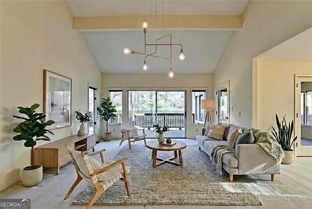 an empty room with chandelier fan