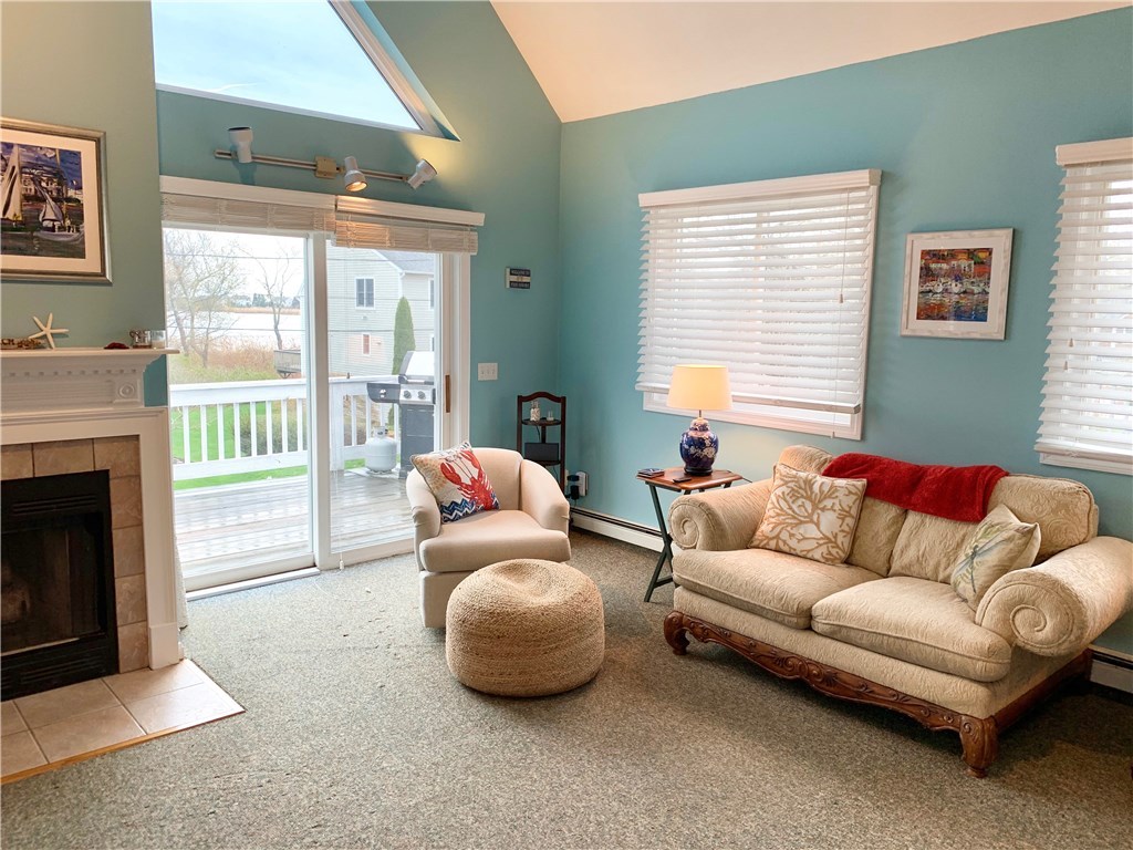 50 Lake Road Narragansett, RI 02882 - Photo 4 of 39 Great room with lovely water views and fireplace