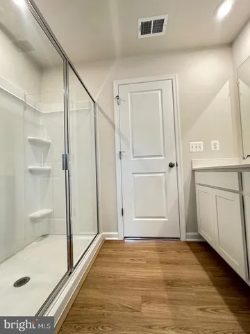 a bathroom with a double vanity sink and mirror