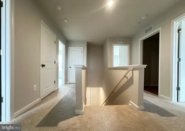 a white toilet sitting next to a bath tub