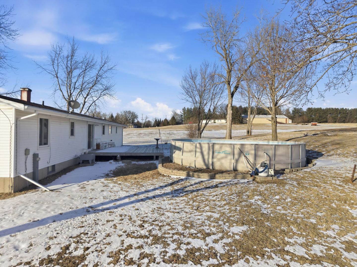 9807 North Leaf River Road Leaf River, IL 61047 - Photo 29 of 38 a view of a house with snow on the side of the road