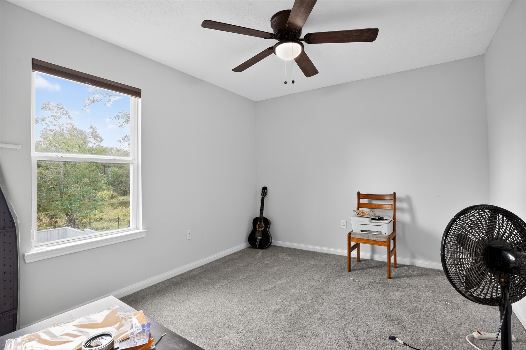 14986 Crockett Road Willis, TX 77378 - Photo 11 of 16 a view of a workspace with furniture and a window