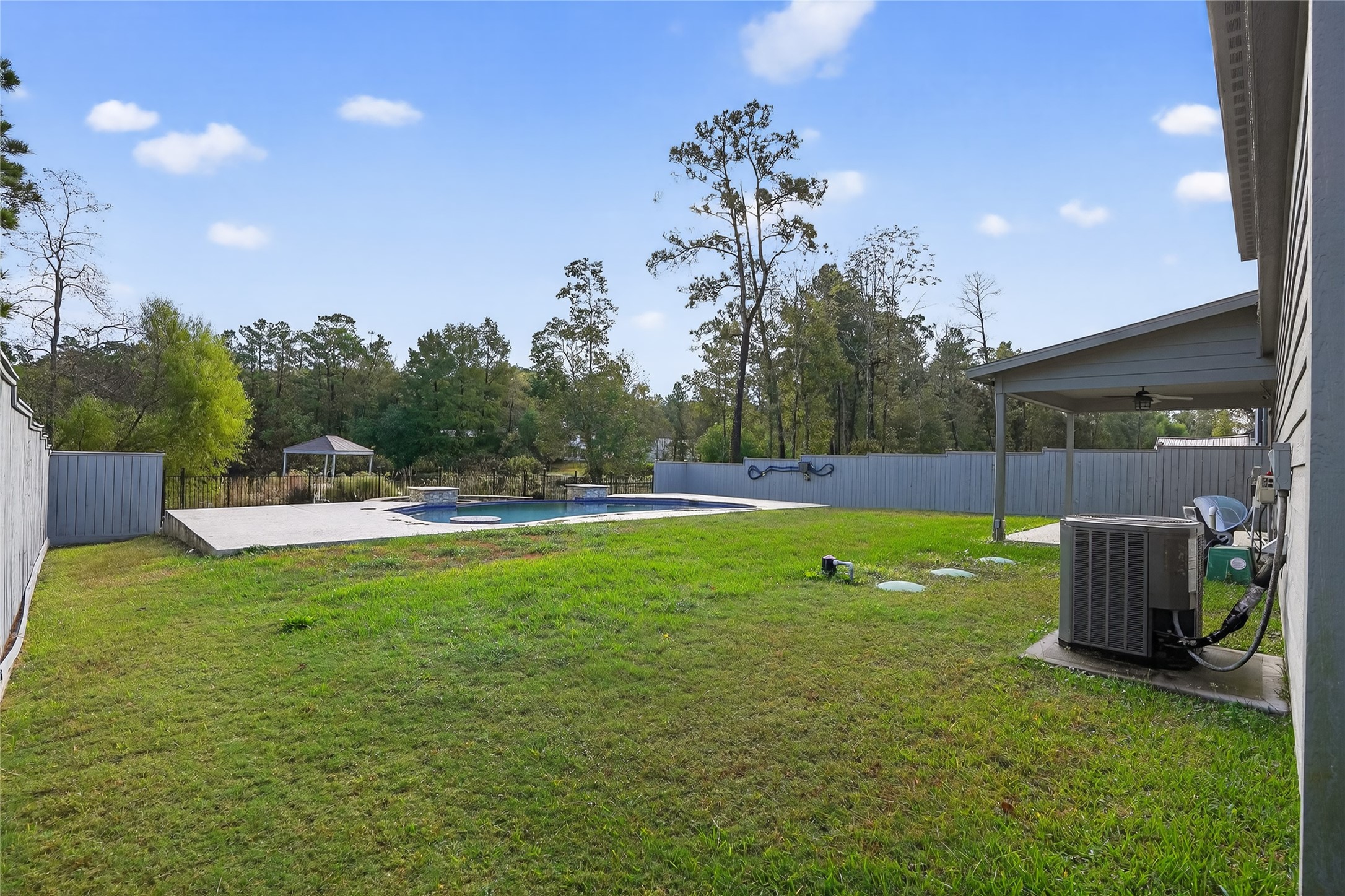 14986 Crockett Road Willis, TX 77378 - Photo 15 of 16 a view of a backyard