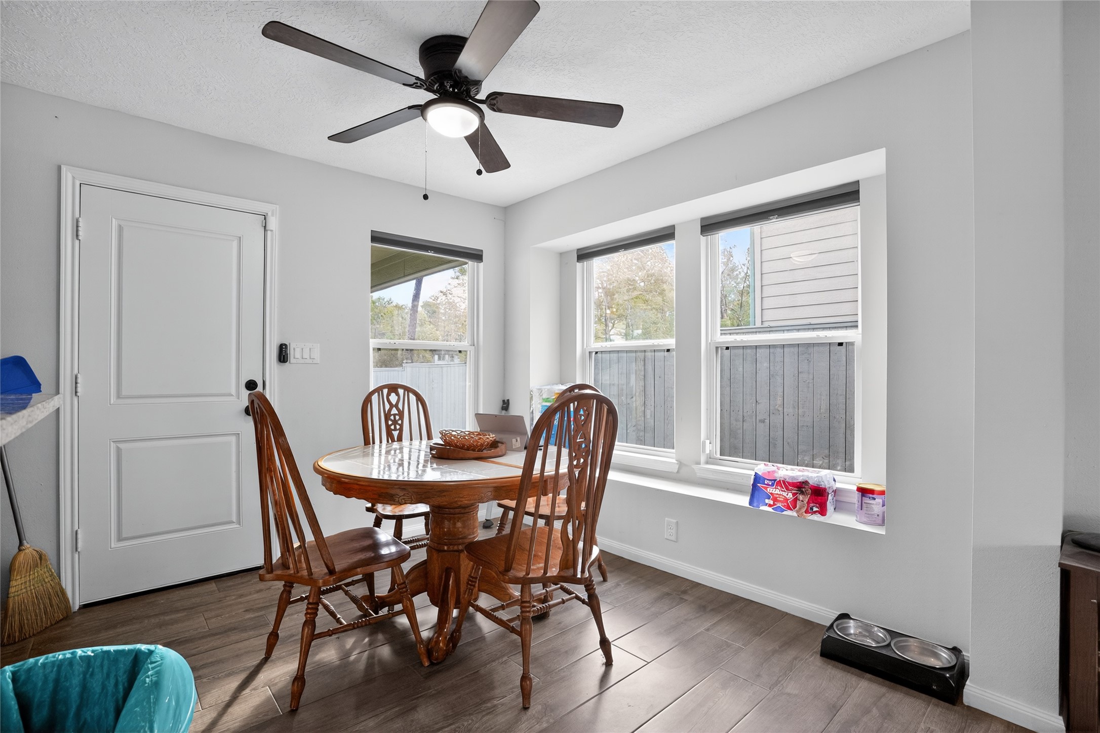14986 Crockett Road Willis, TX 77378 - Photo 5 of 16 a view of a dining room with furniture window and wooden floor