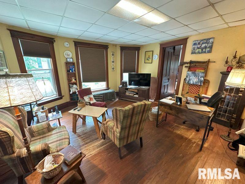 605 Fulton Street Grand Mound, IA 52751 - Photo 5 of 16 a living room with furniture a window and a flat screen tv