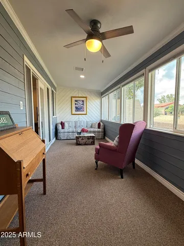 a living room with furniture and a window