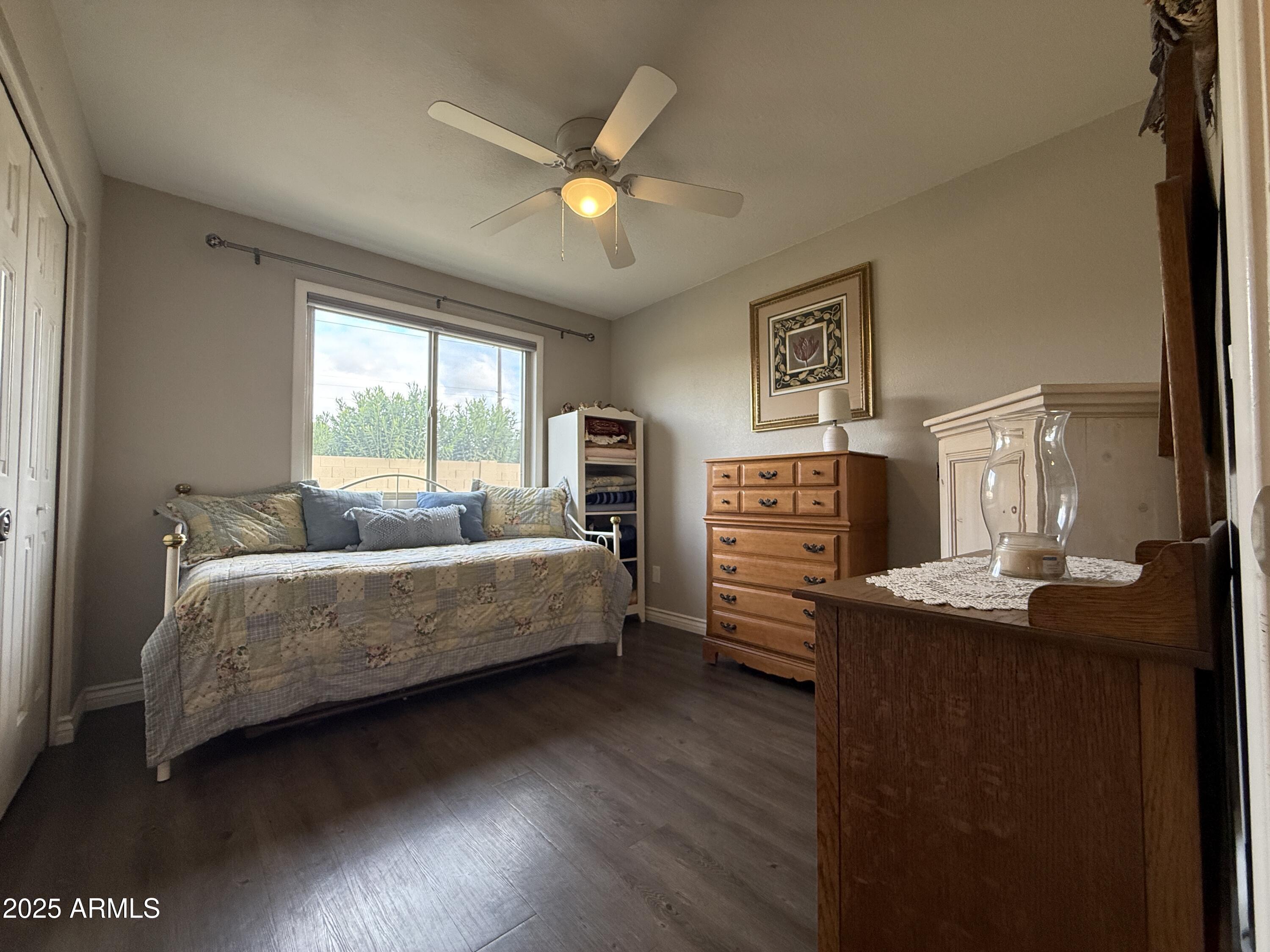 25208 South Angora Court Sun Lakes, AZ 85248 - Photo 18 of 22 a living room with furniture and a flat screen tv