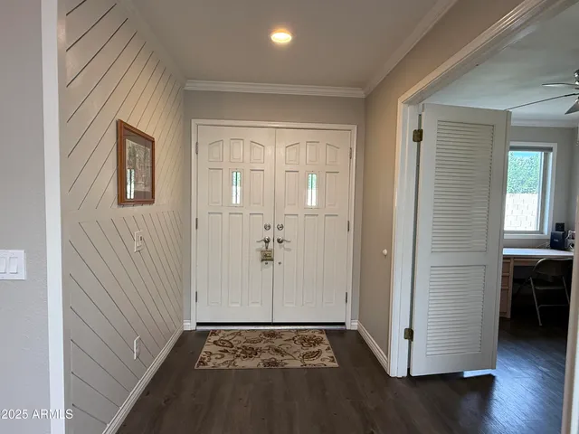 a view of a livingroom with hardwood floor and a sink