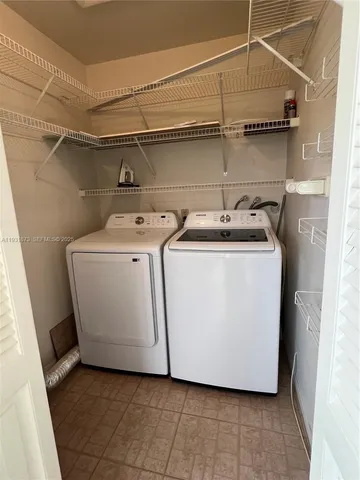 a utility room with washer and dryer